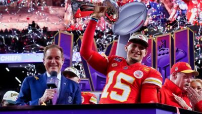 Patrick Mahomes holding Super Bowl trophy