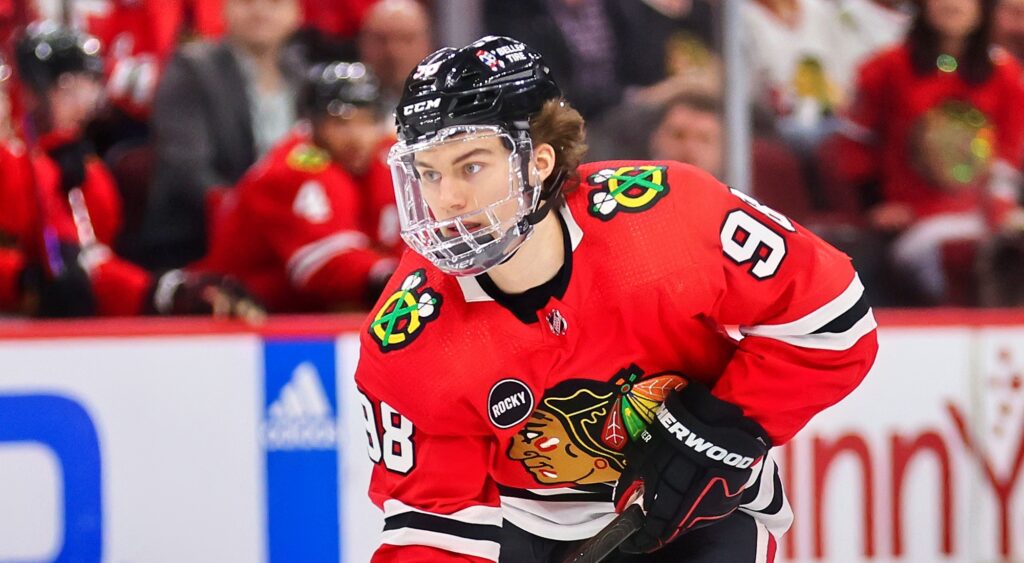 Connor Bedard of Chicago Blackhawks looking on.