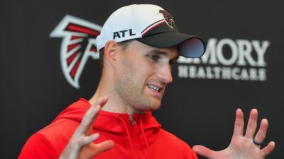 Kirk Cousins speaking to reporters