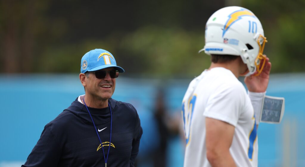 Jim Harbaugh and Justin Herbert during practice