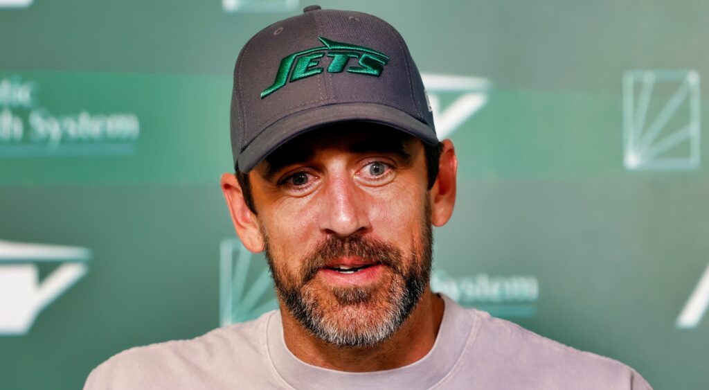 Aaron Rodgers speaks at a press conference.