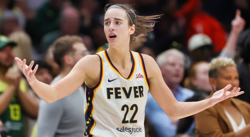 Caitlin Clark shrugs during a game.