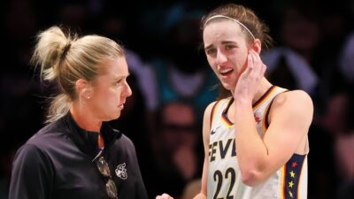 Caitlin Clark and Christie Sides on sidelines