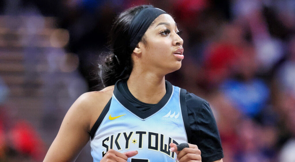 Angel Reese of Chicago Sky looking on.