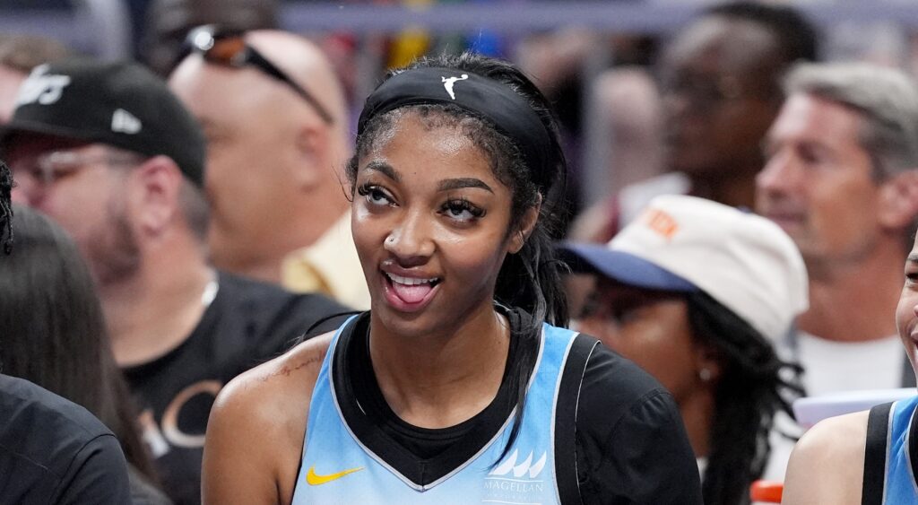 Angel Reese of Chicago Sky looking on.