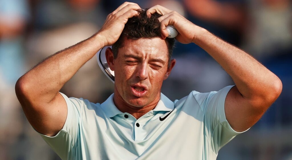 Rory McIlroy looking frustrated with hands on head