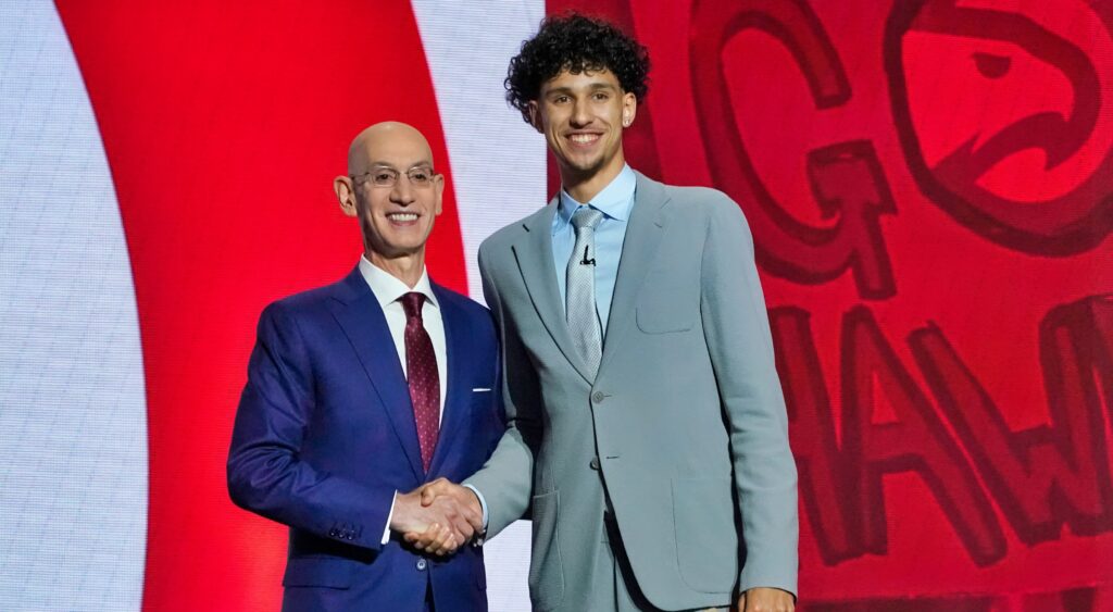 Zaccharie Risacher on stage at the NBA Draft after going first overall to the Atlanta Hawks.