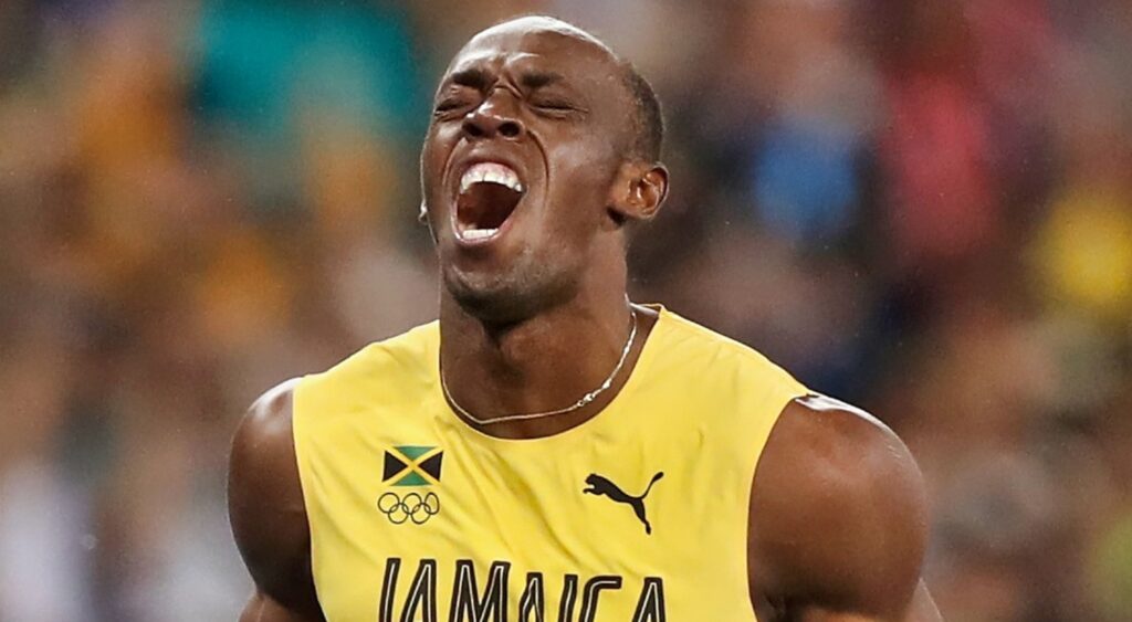 Usain Bolt yells after a race.