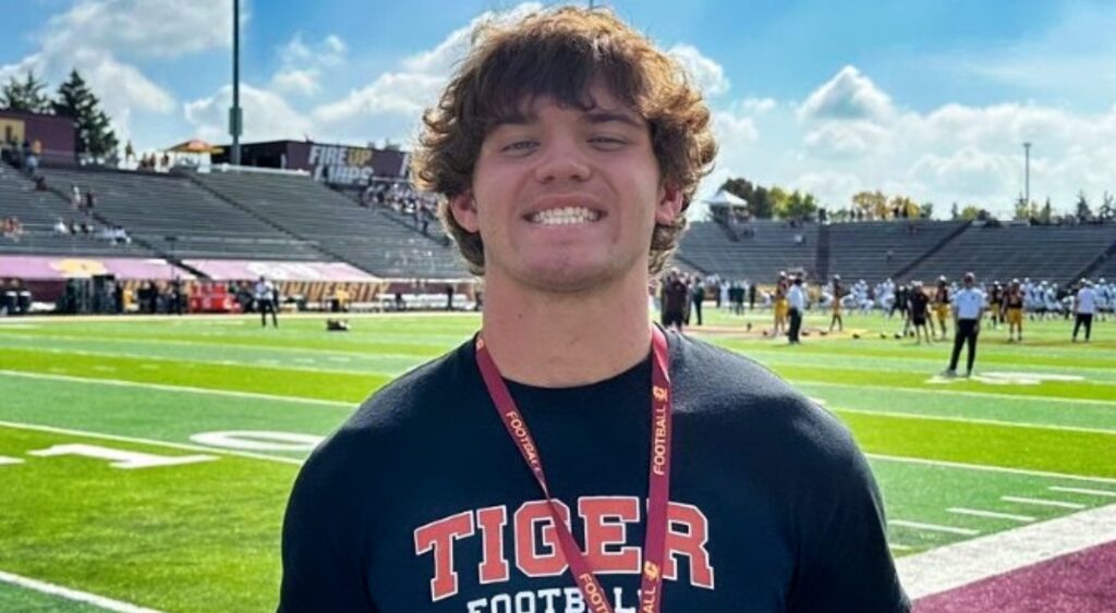 Noah Knigga posing at football field