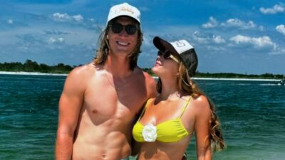 Trevor Lawrence and Marissa Lawrence posing by beach
