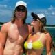 Trevor Lawrence and Marissa Lawrence posing by beach