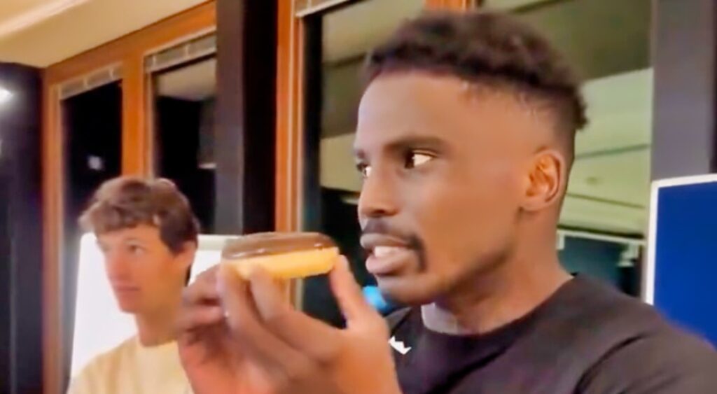 Tyreek Hill eats a donut.