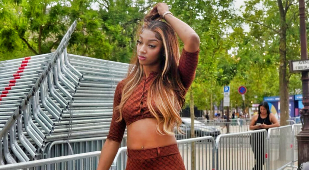 Angel Reese in brown outfit