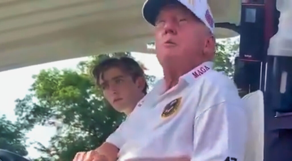 Donald Trump in golf cart with Barron Trump