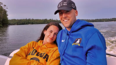 Caitlin Clark and Connor McCaffrey on a lake