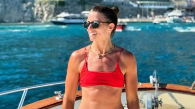 Danica Patrick posing in red bikini on boat