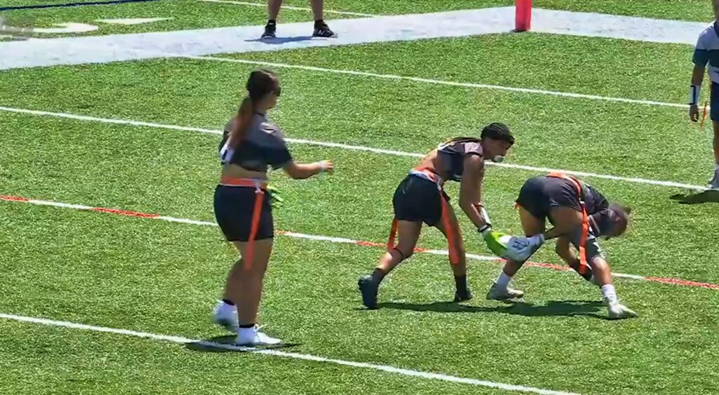 Players running a trick play in the NFL Flag Championships