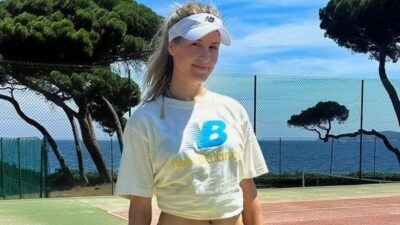 Genie Bouchard posing on tennis court