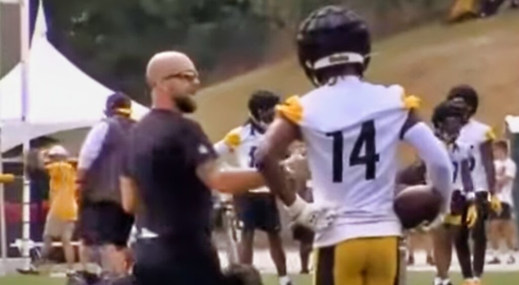 George Pickens on field with coach