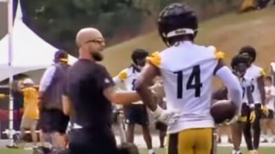 George Pickens on field with coach