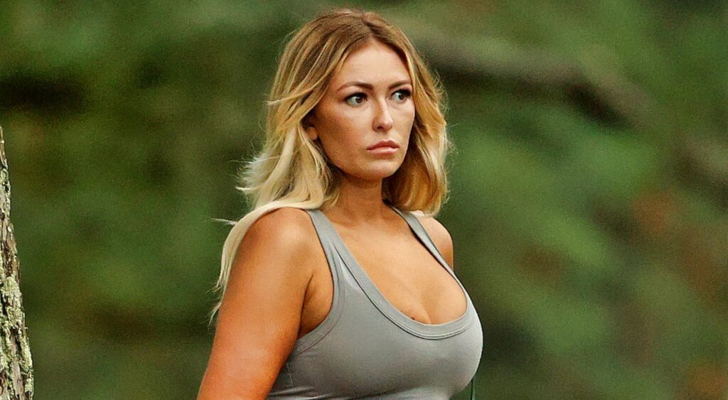 Paulina gretzky watches on the golf course.