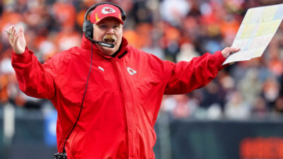 Kansas City Chiefs head coach Andy Reid throwing his hands in the air