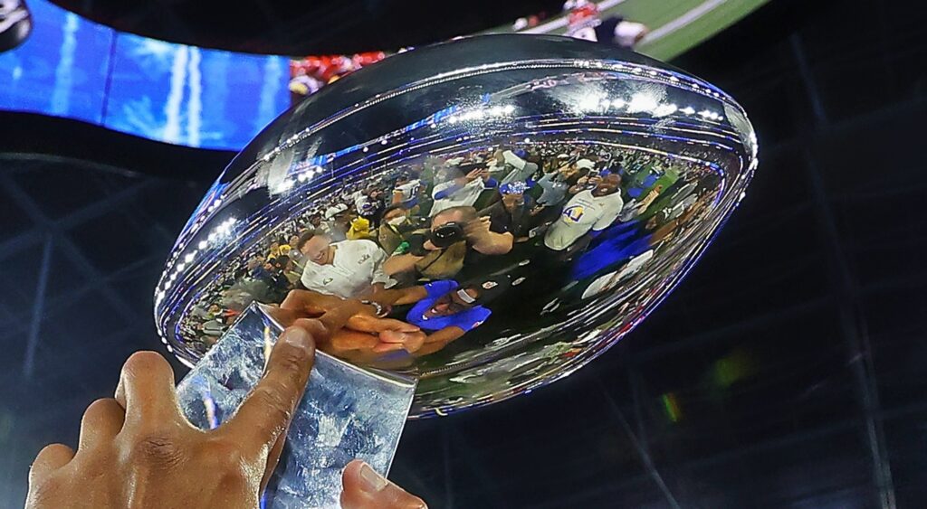 Lombardi Trophy held in air after Super Bowl 56.