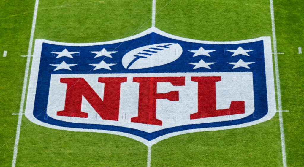 NFL logo shown on field. 