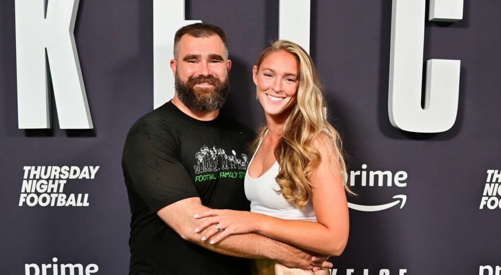 Jason Kelce (left) and wife Kylie Kelce (right) smiling at event.