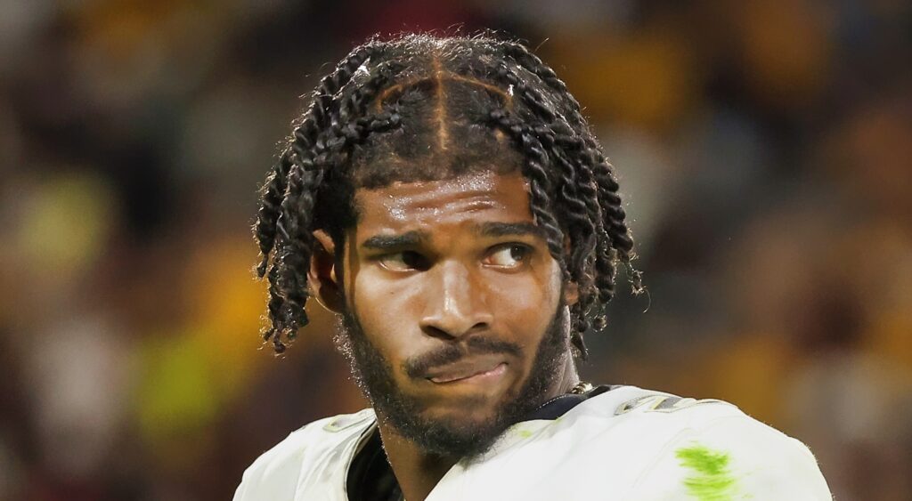 Shedeur Sanders of Colorado Buffaloes looking on.