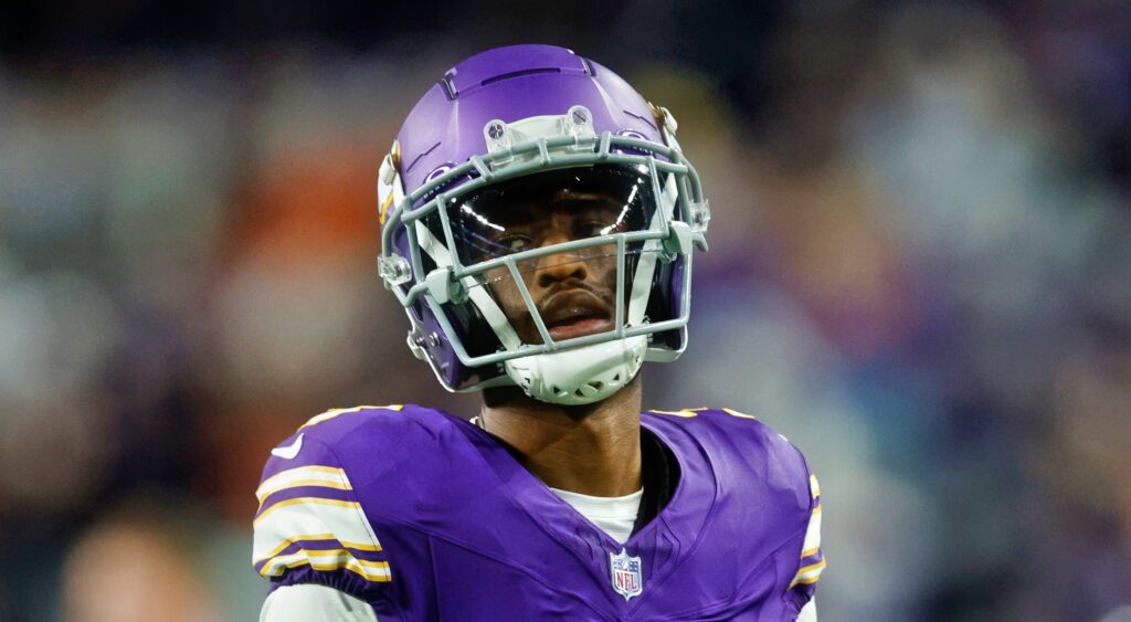 Jordan Addison of Minnesota Vikings looking on.