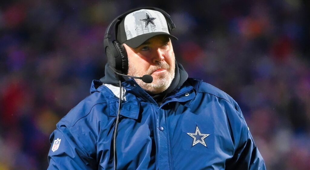 Mike McCarthy of Dallas Cowboys looking on.