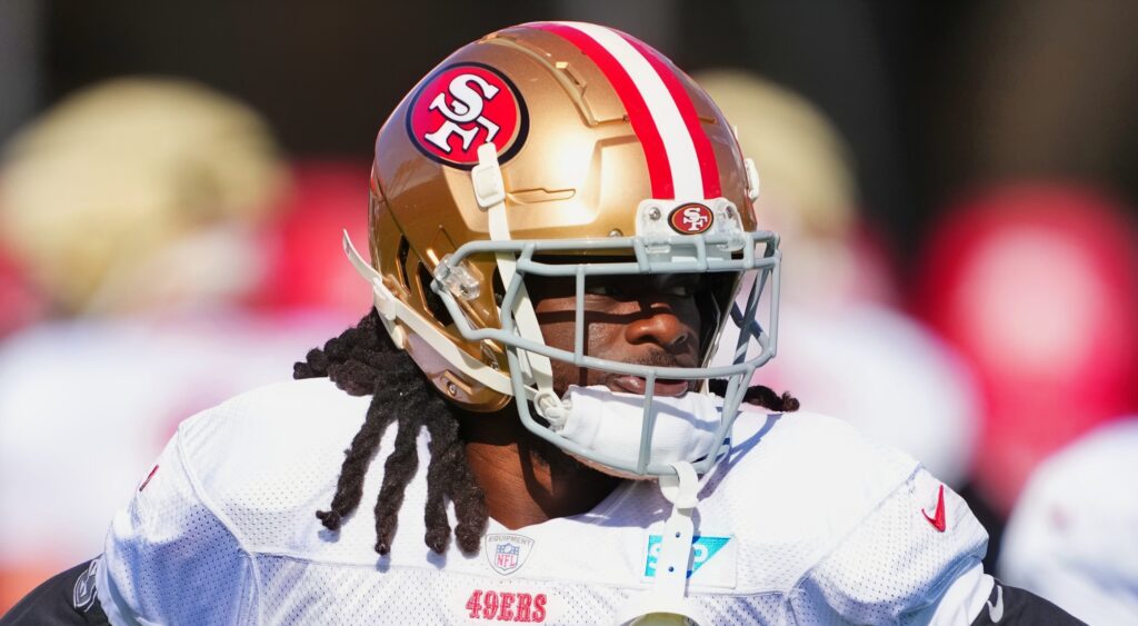 Brandon Aiyuk of San Francisco 49ers looking on.