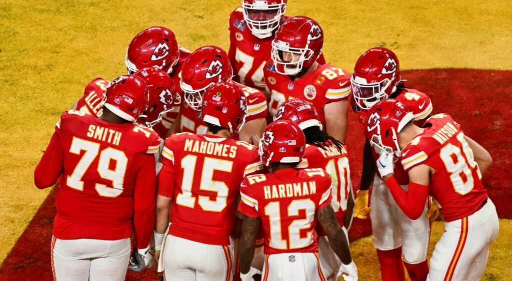 Kansas City Chiefs' players huddle that includes Travis Kelce