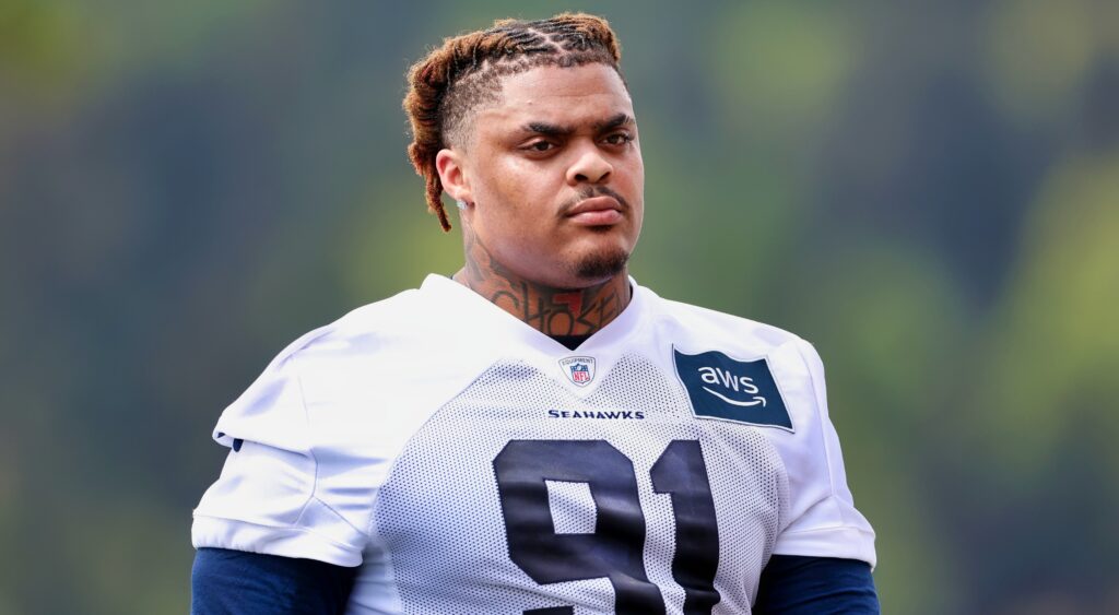 Byron Murphy II looks on during practice.