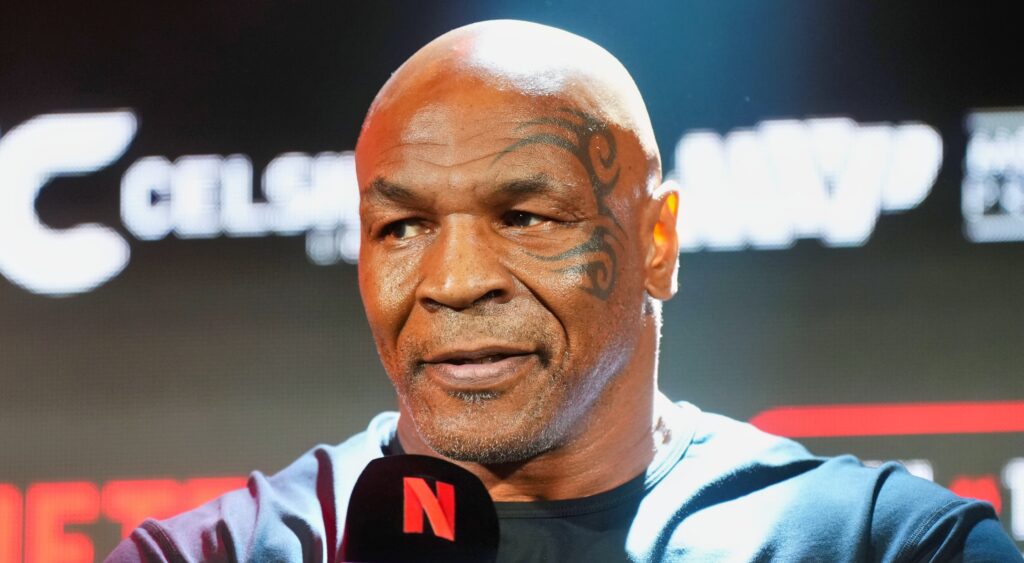 Mike Tyson speaking to reporters at event.