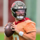 Baker Mayfield holding football