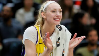 Cameron Brink clapping on sidelines