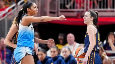 Angel Reese and Caitlin Clark on court