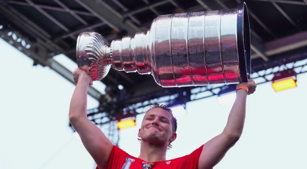 Matthew Tkachuk of Florida Panthers holding Stanley Cup.