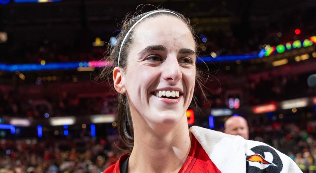 Caitlin Clark of Indiana Fever smiling after game.