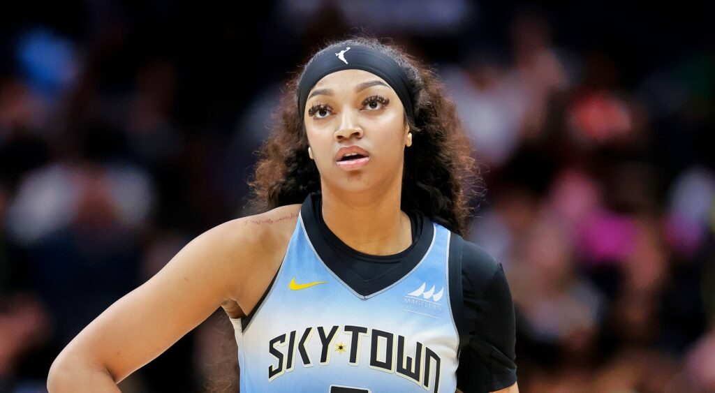 Angel Reese of Chicago Sky looking on.