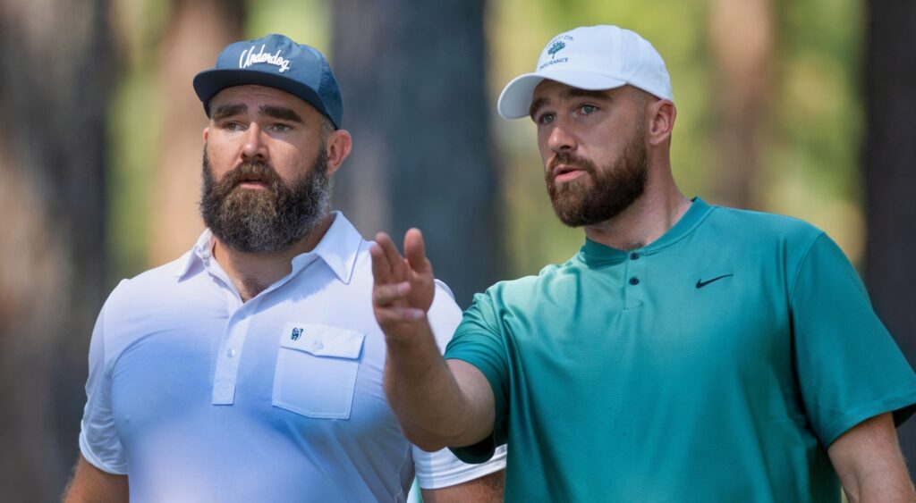 Jason and Travis Kelce talking at golf event.