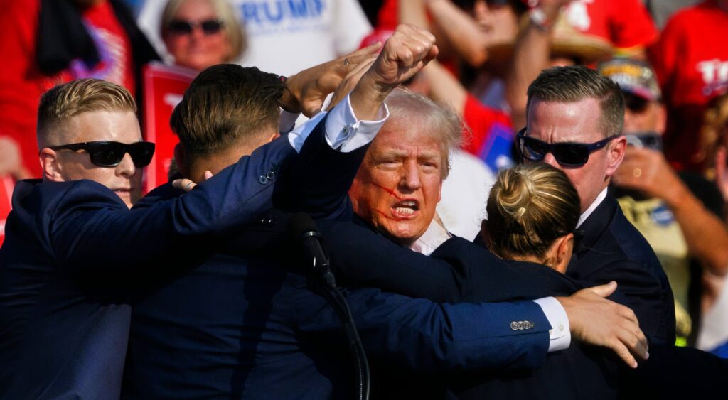 Donald Trump surrounded by Secret Service agents at his rally.