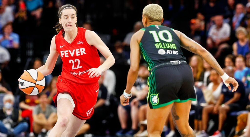 Caitlin Clark dribbling against Courtney Williams