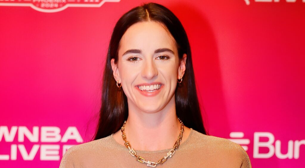 Caitlin Clark posing at WNBA Orange carpet