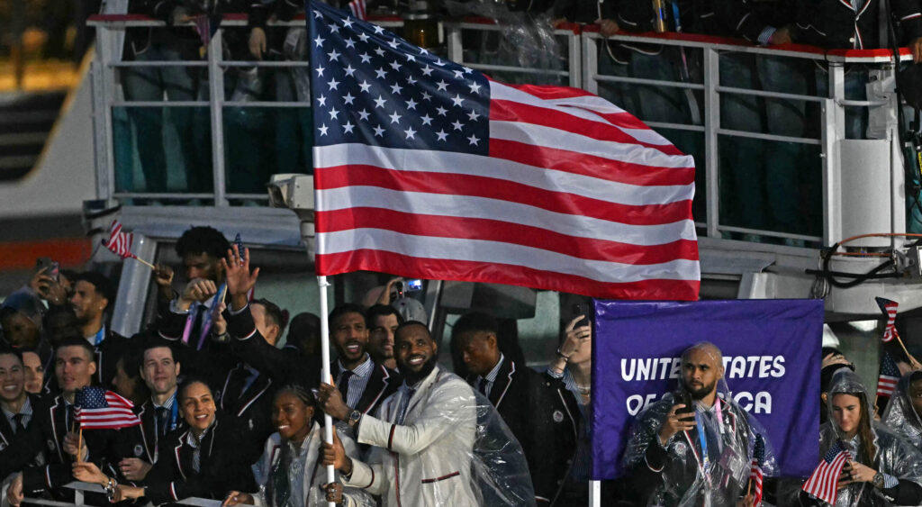 LeBron James Becomes The First Male Basketball Player In History To Bear The USA Flag At The Olympic Opening Ceremony