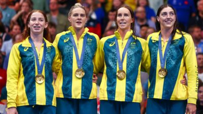 Australian women's swim team posing with medals