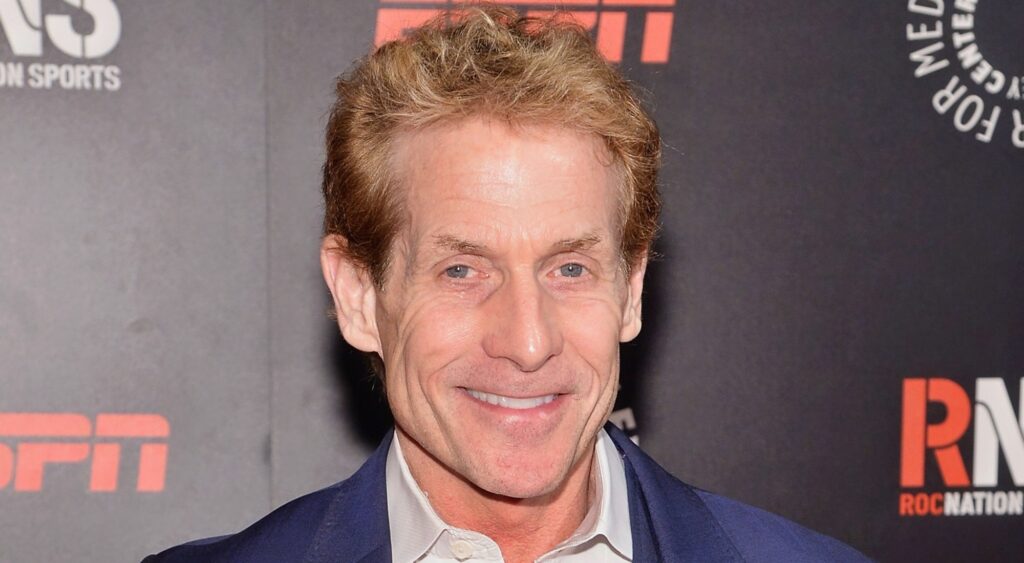 Skip Bayless poses on the red carpet.