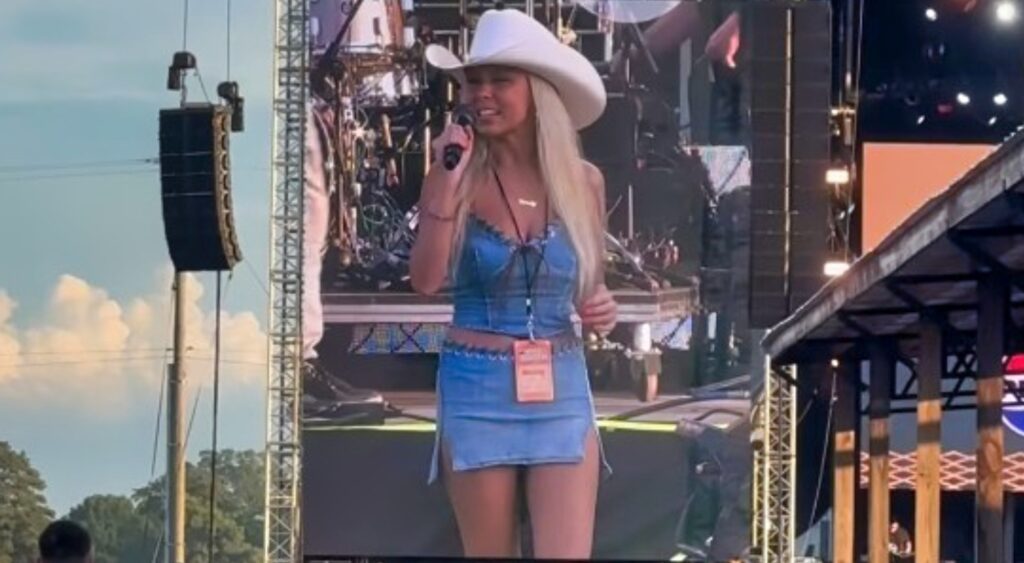 Haliey Welch on stage at country music festival